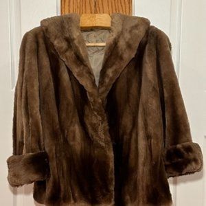 Hip length MEDIUM BROWN fur with cuff sleeves and pockets